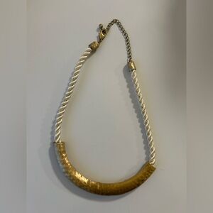 Elegant Gold Necklace with White Cord